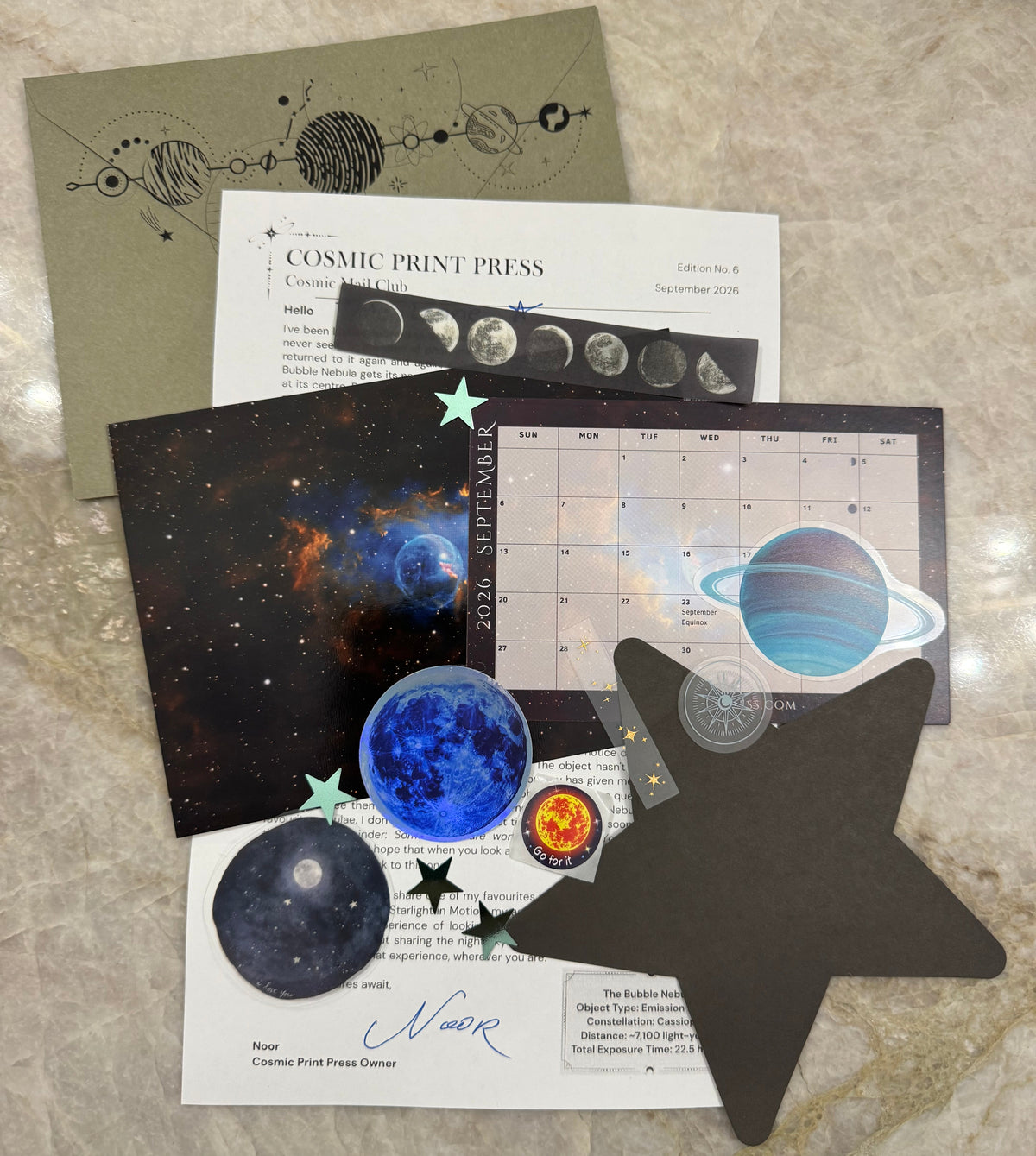 Space, themed stickers and prints of a nebula and personal letter for an Astronomy mail club snail mail. Photos are taken by Noor and Astrophysicist who uses her telescope to capture the images featured in her astronomy space themed mail club